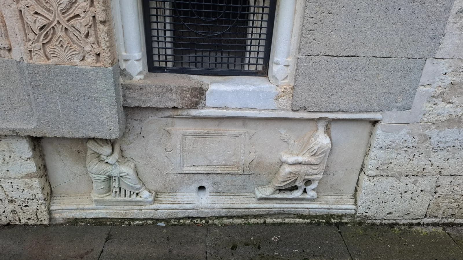Bird reliefs incorporated into the wall of Eşrefoğlu Mosque.