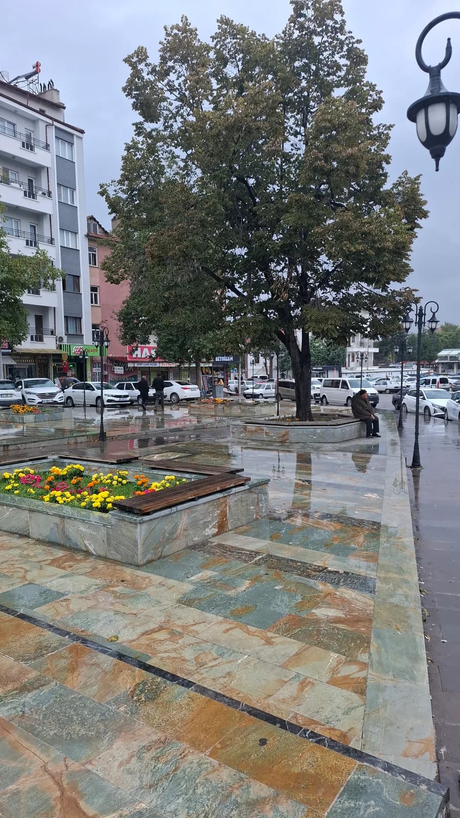 Stone-paved plaza, flower beds and street lighting in central Beyşehir.